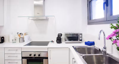 Fully equipped kitchen at Poblenou Service Apartments