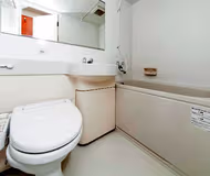 Simplistic living area in Awajimachi Apartments