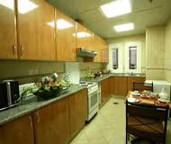 Fully equipped kitchen at Sultan Bin Zayed the First St Serviced Apartments, Al Muroor