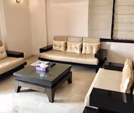 Simplistic living area in Cyber City Serviced Apartments