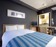 Simplistic living area in Tokui-Cho Serviced Apartments