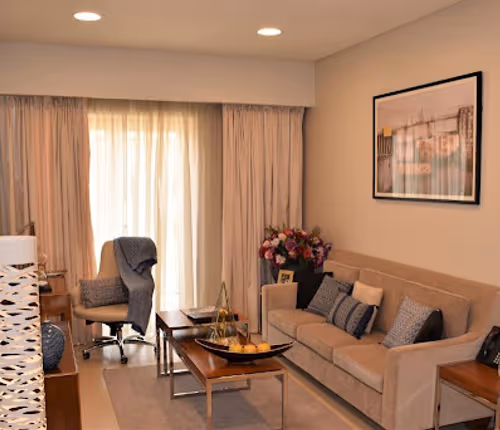 Living room at Al Ghubra Street Serviced Apartment