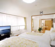 Simplistic living area in Yoshinocho Apartments