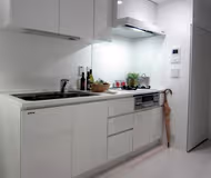 Simplistic living area in Ishikawacho Apartments