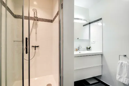 Family bathroom at AN UBER CHIC APARTMENT NEXT TO LOUVRE