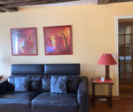 Comfy living area at NESTLED UNDER THE ROOFTOPS IN LE MARAIS