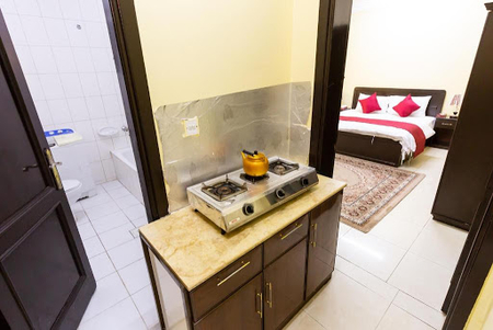Basic kitchenette at Sayyid Ash Shuhada Street Serviced Apartment