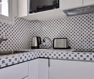 Fully equipped kitchen at Rue du Colisée Serviced Apartment, Champs Elysees