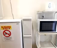 Simplistic living area in Minato-Roppongi Apartments