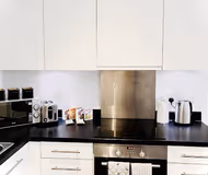 Fully equipped kitchen at Stanmore Place 1 Bedroom Apartments