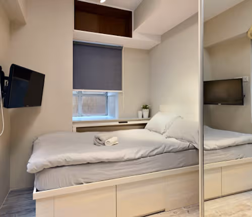 Luxury bedroom at Possession Street Apartments, Hong Kong