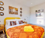Master bedroom at Funky 2 Bed Duplex Apartment in the Heart of Historic Rochester