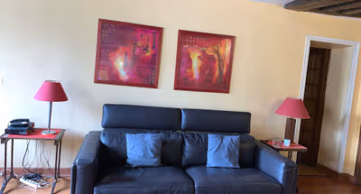 Spacious living area at NESTLED UNDER THE ROOFTOPS IN LE MARAIS