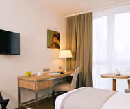 Open plan bedroom at Roissy Park Serviced Apartment, Champs Elysees