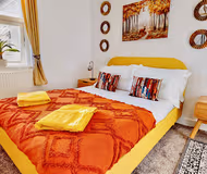 Master bedroom at Funky 2 Bed Duplex Apartment in the Heart of Historic Rochester