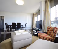 Simplistic living area in Avenue Rapp Serviced Apartment, Palais-Bourbon