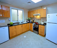 Fully equipped kitchen at Baghdad Street Serviced Apartments, Al Nahda 2