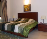 Simplistic living area in Noida Corporate Apartments