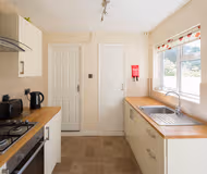 Fully equipped kitchen at Stylish Modern House