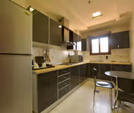 Full kitchen at Mutaib bin Abdulaziz Road Serviced Apartment