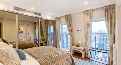 Luxury bedroom at Hyde Park Gate Apartment