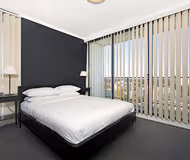 King sized bedroom at Church Street Apartments, Parramatta