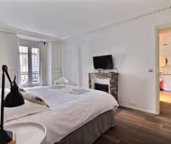 Cosy bed at Relais Maubourg Serviced Apartment, Palais-Bourbon