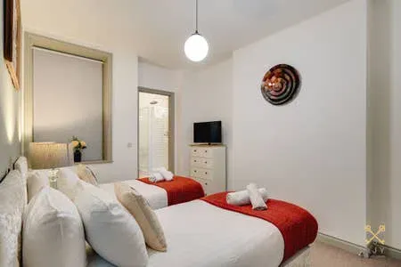 Luxury bedroom at Queens Serviced Apartments