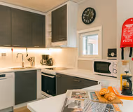 Kitchen in a twin bedroom at Forenom Aparthotel Helsinki Kamppi