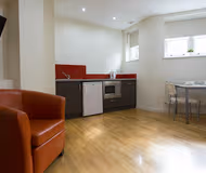 Simplistic living area in Studios at St. James House near Holland Park