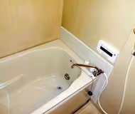 Simplistic living area in Kamiooka Apartments