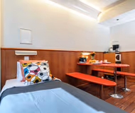 Living area at a triple room  Forenom Aparthotel Tampere