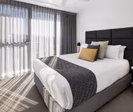 Luxury bedroom at Hercules Street Serviced Apartments
