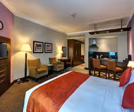 King sized bedroom at Al Muraqqabat Street Serviced Apartments