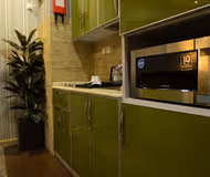 Basic kitchenette at Al Manani Street Serviced Apartment