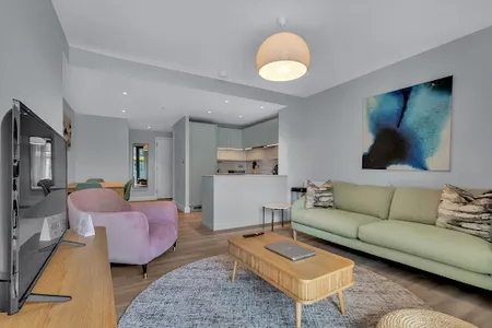 Living area at Olympic Way Apartment in Wembley Park by MySquare