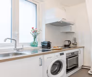 IN THE BEAUTIFUL TREE LINED BOULEVARD, JUST OFF ARC DE TRIOMPHE