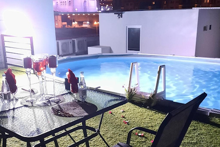 Pool side at Al Ghubrah Street Serviced Apartment