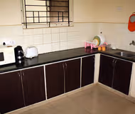 Simplistic living area in E-City Apartments