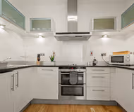 Fully equipped kitchen at South Quay Serviced Apartments by MySquare