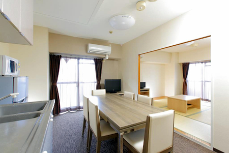 Simplistic living area in Tokui-Cho Serviced Apartments