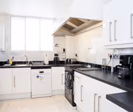 Fully equipped kitchen at Spacious &amp; Modern 1 BR - ZONE 1 - Netflix
