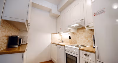 Fully equipped kitchen at Forenom Helsinki Albertinkatu