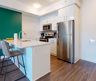 Fully equipped kitchen at Carruthers Ave Serviced Apartment