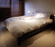 Cosy living area in SonezakishinchiKita Serviced Apartment