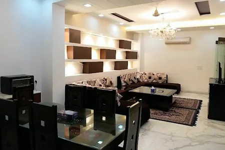 Simplistic living area in Green Park Studio Apartments