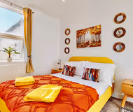 Master bedroom at Funky 2 Bed Duplex Apartment in the Heart of Historic Rochester