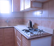 Equipped Kitchen at Al Rehab Serviced Apartment