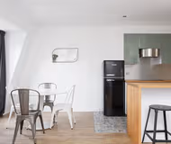 Simplistic living area in Saint Honore Serviced Apartment, Champs Elysees