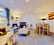 Comfy living room at Funky 2 Bed Duplex Apartment in the Heart of Historic Rochester